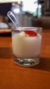 Vanilla jelly pudding with banana and strawberry fruit slice dessert appetizer in a small glass cup Royalty Free Stock Photo