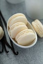 Vanilla macarons in a little bowl