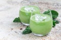 Vanilla, mint, spinach and coconut milk detox green smoothie in a glass, horizontal, copy space Royalty Free Stock Photo