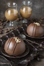 Vanilla mousse cake with dark chocolate, sweet desser on table with glass of liquor Royalty Free Stock Photo