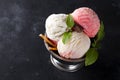 Vanilla and pink ice cream in a bowl with frozen berries and waffle cone Royalty Free Stock Photo