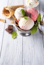 Vanilla and pink ice cream in a bowl with frozen berries and waffle cone Royalty Free Stock Photo