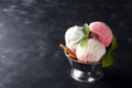 Vanilla and pink ice cream in a bowl with frozen berries and waffle cone Royalty Free Stock Photo