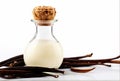 Vanilla pods with essence in a bottle on white background Royalty Free Stock Photo