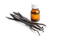 Vanilla pods and vanilla essence in glass bottle Royalty Free Stock Photo