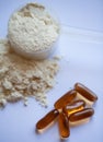 Vanilla protein powder with CLA softgel capsules Royalty Free Stock Photo