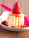 Vanilla pudding with strawberry sauce Royalty Free Stock Photo