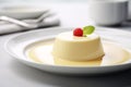 Vanilla pudding on white plate.