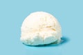 vanilla scoop of sundae ice cream isolated on blue background, close up Royalty Free Stock Photo