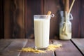 vanilla shake in a frosty glass with a drip down the side on a wood surface Royalty Free Stock Photo