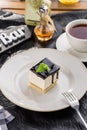 Vanilla souffle with dark chocolate glaze and cup of tea on black table Royalty Free Stock Photo