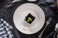 Vanilla souffle with dark chocolate glaze and cup of tea on black table Royalty Free Stock Photo