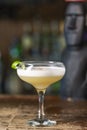 Vanilla Sour cocktail with egg white and lemon juice  on the bar. Blurred background Royalty Free Stock Photo