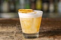 Vanilla Sour cocktail with egg white and lemon juice  on the bar Royalty Free Stock Photo