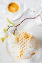 Vanilla sponge cake with cream and white chocolate decorate. Sliced piece of cake on white plate. Served on wooden table. Favorite Royalty Free Stock Photo