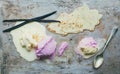 Vanilla and strawberry ice-cream scoops with vanilla sticks and