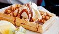 Vanilla sweet ice cream on top of brown golden waffle Royalty Free Stock Photo