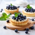 Vanilla tartlets with blueberry berries