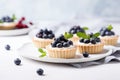 Vanilla tartlets with blueberry berries