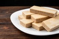 Vanilla wafer biscuit on dark wooden background