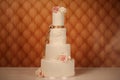 Vanilla wedding cake with roses Royalty Free Stock Photo