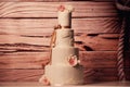 Vanilla wedding cake with roses Royalty Free Stock Photo