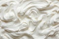 Vanilla yogurt close up on white backgroundtop view with spoon, fully covering the frame.