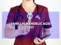 VANILLYLMANDELIC ACID TEST VMA inscription on the screen. Close up Doctor hands holding black smart phone Royalty Free Stock Photo