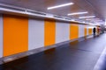 Vanishing perspective view of pedestrian underpass tunnel with empty walls, blank billboard spaces. Visual for ad placements, Royalty Free Stock Photo