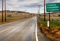 Vanishing viewpoint highway, storm clouds, wet pavement Royalty Free Stock Photo