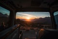 vanlife with a view of the sun setting behind the mountains