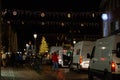 Vans waiting to get into aachen markt to tear down and clean up after christmas market