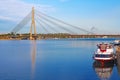 Vansu bridge over Daugava river and pleasure boats in Riga, Latvia Royalty Free Stock Photo