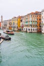 Vaparetto water bus, water taxi/ taxicab and other boat sailing between buildings in the Grand Canal, Venice