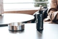 Vape stands on a wooden table in cafe Royalty Free Stock Photo