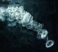 Vape trick smoke ring on dark background