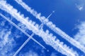 vapor trails and passenger jets in the sky