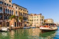 Medieval facades on the Grand Canal and a vaporetto in Venice in Veneto, Italy