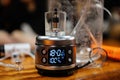 vaporizer being used for aromatherapy, with stopwatch in view to time the session