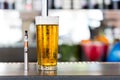 Vaporizer pipe and glass of beer Royalty Free Stock Photo