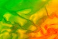 Vaporwave style texture background: neon orange and green funky paint texture
