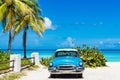 American blue 1955 classic car with a white roof parked direct on the beach in Varadero Cuba Royalty Free Stock Photo