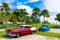 American red brown 1954 vintage cars parked under blue sky near the beach in Havana Cuba - Royalty Free Stock Photo