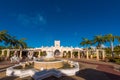 VARADERO, MATANZAS, CUBA - MAY 18, 2017: View of the fountain and the building. Copy space for text. Isolated on blue background.