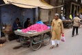 A men selling lotus flowers petals on a local Indian market