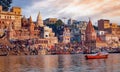 Varanasi city with old architectural buildings and temples at sunset.