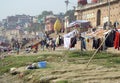 Varanasi ghats people washing clothes on the street on the banks of the river Ganges Royalty Free Stock Photo