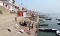 Varanasi ghats people washing clothes on the street on the banks of the river Ganges