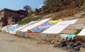 Varanasi ghats people washing clothes on the street on the banks of the river Ganges Royalty Free Stock Photo