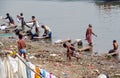 Varanasi ghats people washing clothes on the street on the banks of the river Ganges Royalty Free Stock Photo